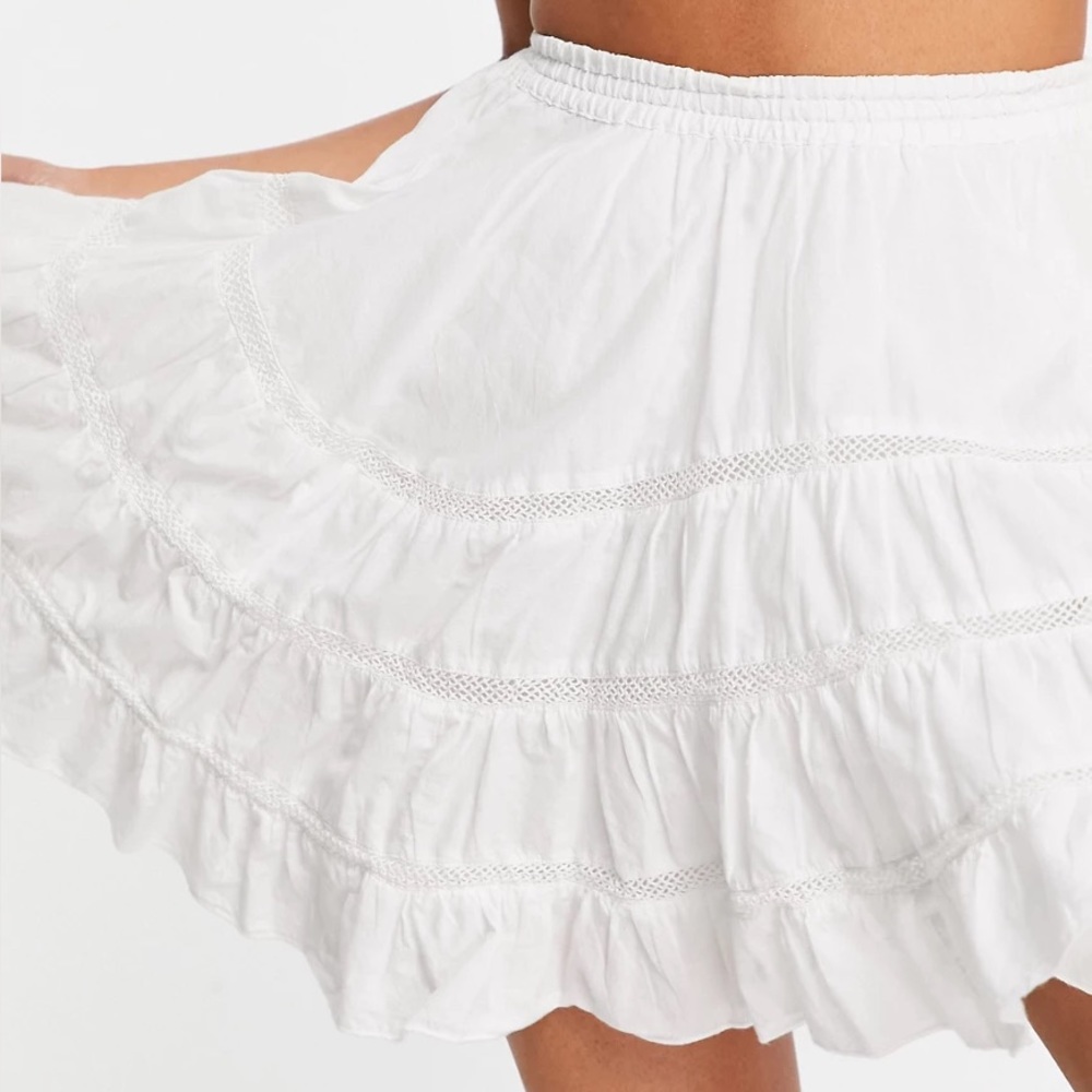ASOS Design mini skirt with handkerchief hem and lace insert
